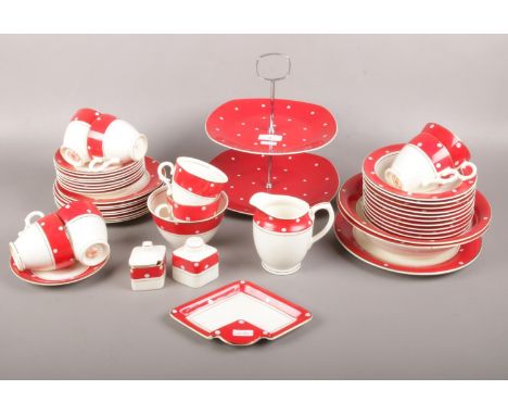 A Crownford Burslem ceramic tea set, with red/white spot design, cups, saucers, side plates, milk jug, sugar bowl etc to incl