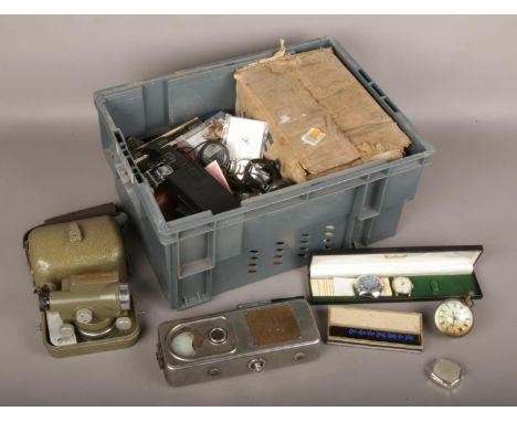 A box of collectables to include Astral watch, Small theodolite, camping light, car motor, etc.  