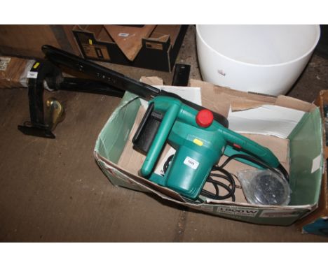 An electric Bosch chainsaw with spare chain 
