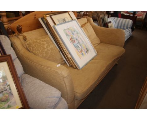A gold upholstered three seater settee