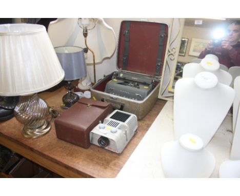 A Royal typewriter in fitted case together with a Norris projector sold as collectors item
