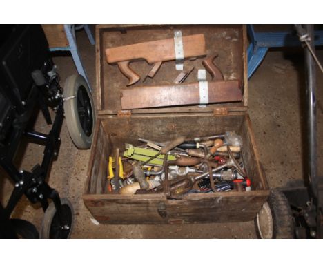 A metal bound wooden box and contents of various tools 