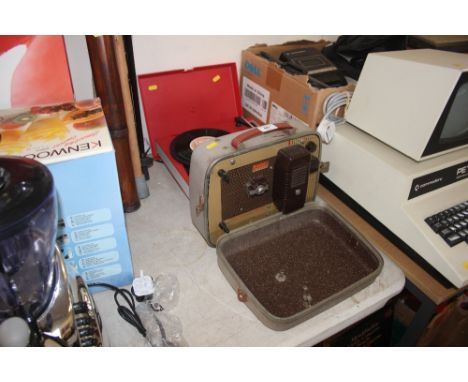 A Brownie projector together with a record player 