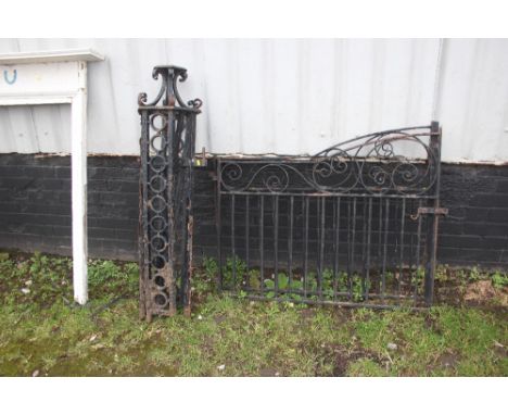 A metal gate post; together with a pair of metal gates 