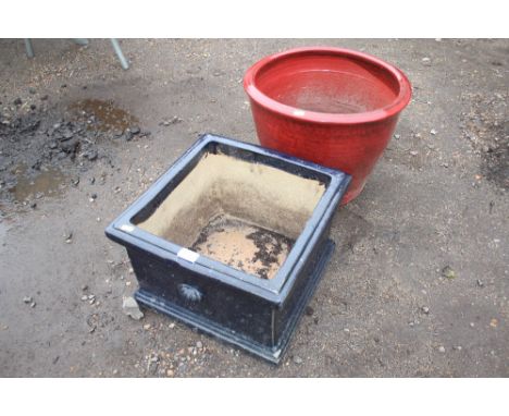 A red glazed planter; together with a blue glazed planter 