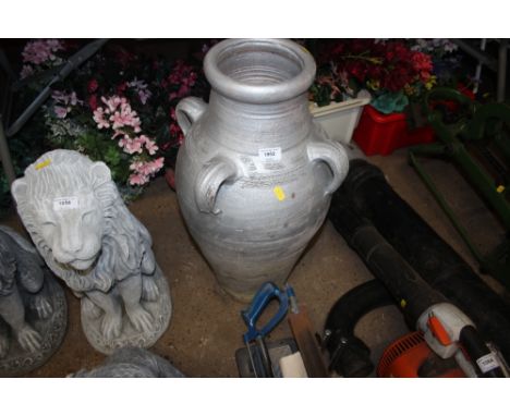 A silver painted terracotta planter 