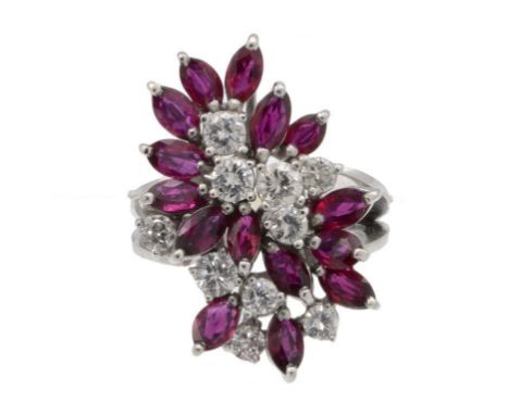 A RUBY AND DIAMOND RING, C1960  with navette shaped rubies and round brilliant cut diamonds, in white gold, unmarked, size L