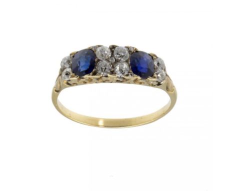 A SAPPHIRE AND DIAMOND RING  with old cut round and cushion shaped diamonds and sapphires, gross weight 4g, in gold, size T +