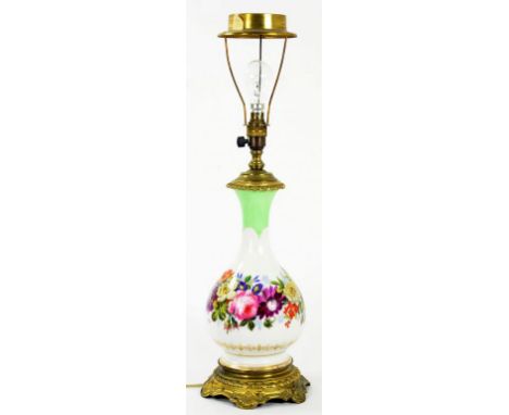 A BRASS MOUNTED FRENCH PORCELAIN VASE SHAPED OIL LAMP, PAINTED WITH FLOWERS, ADAPTED FOR ELECTRICITY, 40CM EXCLUDING FITMENT 