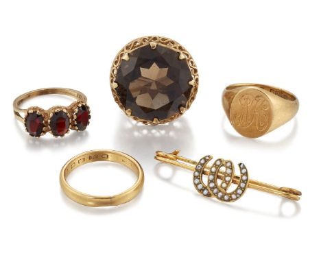 A group of jewellery, comprising: a smokey quartz single stone ring with pierced gallery and hoop; a 9ct gold, garnet three s