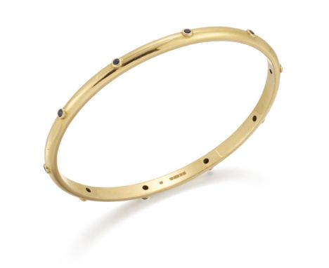 Theo Fennell, a gold and sapphire bangle, by Theo Fennell accented with circular-cut sapphires, signed Fennell, British hallm
