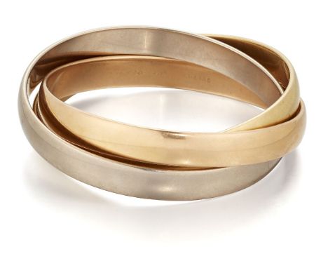 Cartier, a Trinity bangle, by Cartier composed of three interlocking bangles, signed Cartier, numbered.Good general condition