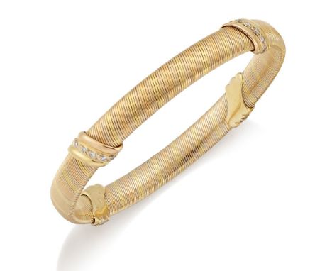 Cartier, diamond bangle, by Cartier, of twisted three tone design, accented with brilliant-cut diamonds, signed Cartier, numb