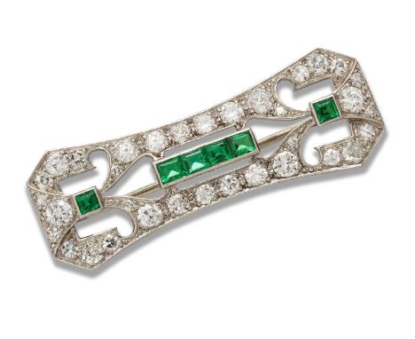 A diamond and emerald panel brooch, the pierced rectangular panel set with brilliant and single cut diamonds with calibre eme