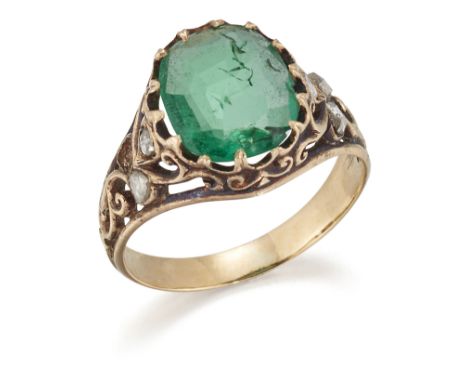 An emerald and diamond ring, late 19th century, set with an oval-shaped emerald, the shoulders enhanced with rose-cut diamond