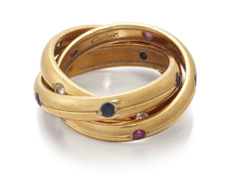 Cartier, a Trinity ring, by Cartier, accented with circular-cut rubies and sapphires and brilliant-cut diamonds, signed Carti