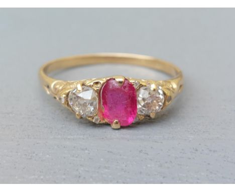 An old cut three stone ruby &amp; diamond ring - ruby a/f.  Finger size X.