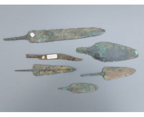 A Bronze Age razor and five spear heads, the largest 9.5". (6)