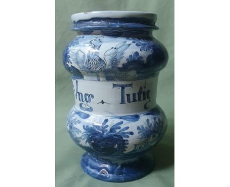 An antique pottery albarello - 'Ung Tutie', decorated with a nude figure and buildings, 7.5" high.