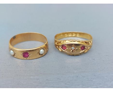 Two small ruby set 18ct gold band rings - one with a diamond, Chester 1907, the other with pearls, Birmingham 1899.  (2)