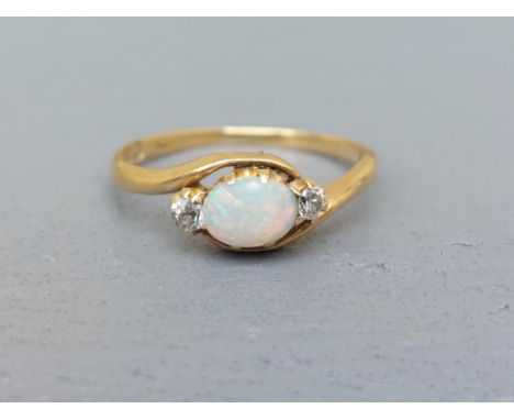 A small opal &amp; diamond set three stone 18ct gold  ring - Birmingham 1903.  Finger size N.
