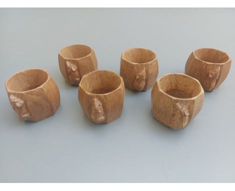 A set of six 'Mouseman' Thompson oak napkin rings, the exteriors of octagonal form.