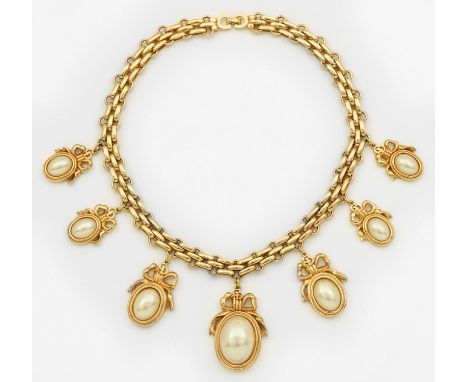 Vintage Collier von Christian Dior aus den 80er Jahren Vergoldet. Breite Gliederkette mit gereiht angeordneten, schleifenbekr