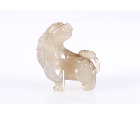 Chinese jade carving of a lion dog, unsigned, 7cm tall, 7cm long.&nbsp; 