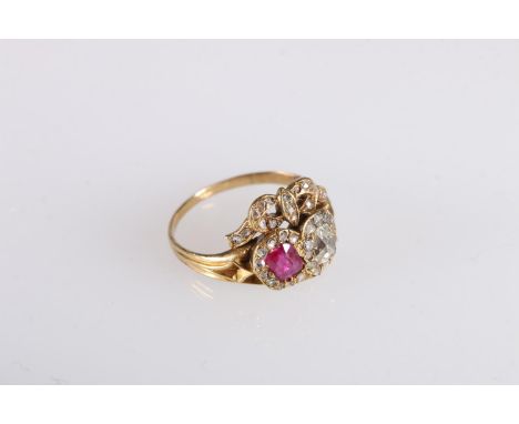 Antique ruby and diamond ring, the large diamond and ruby encircled by diamonds and surmounted by diamond encrusted ribbon bo