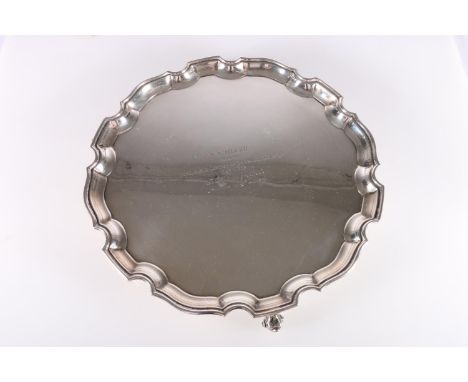 Elizabeth II silver salver with piecrust edge, raised on three scroll supports, presentation inscription 'W M MILLER RECORDER