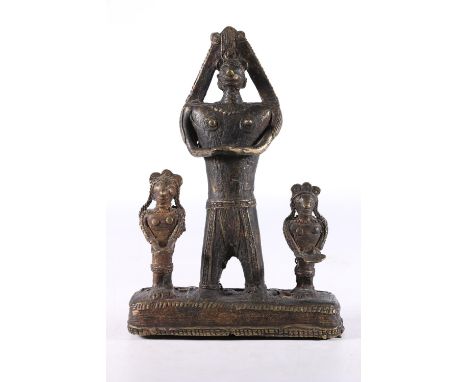 African Benin style cast metal figure group the central large figure flanked by smaller figures, 21.5cm tall.&nbsp; 