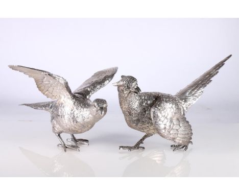 Pair of hollow cast silver table models of pheasants, by C J Vander Ltd, London 1969, 30cm long, 1676g gross. 