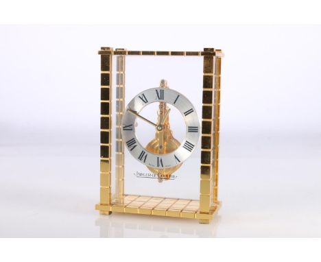 Jaeger Le Coultre mantle clock with floating chapter ring and visible works, gilt metal case, the base stamped '561', 12cm ta