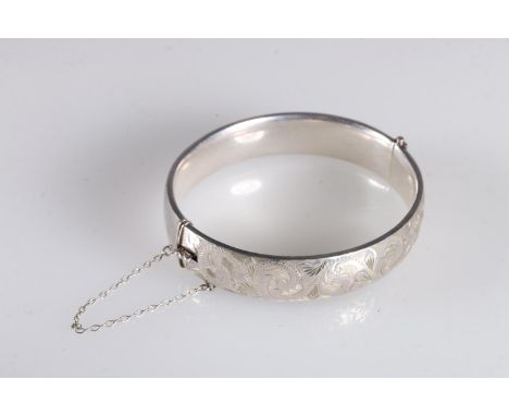 Georg Jensen hinged bangle with foliate decoration to one side hallmarked GJLd, london 1964, 6cm, 24g. 