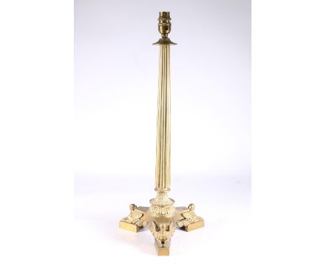 Gothic style brass table lamp with reeded tapered column on platform base adorned with mythical winged female appliques, stam