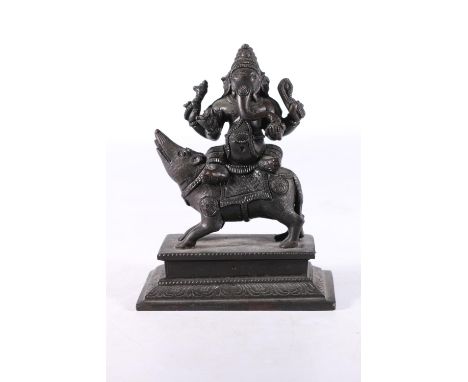Eastern cast metal model of Ganesh and his vahana modelled as Ganesh sat on an Indian Bandicoot rat, 15cm tall.&nbsp; 