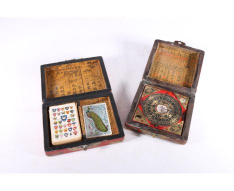 Chinese painted red lacquer box with bird design containing a compass, 14cm x 14cm and a similar card box 17cm x 12cm. 