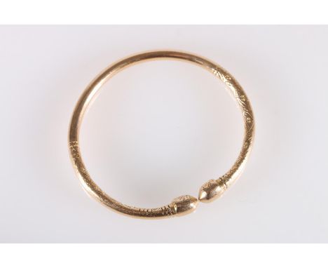 18ct gold West Indian torque shaped bayras bangle with incised decoration, stamped '18ct', 48.5g. 