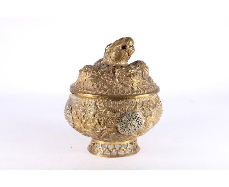 Indian brass pot and cover, the body decorated with all over repoussé figure, snake and animal designs, the cover with four r