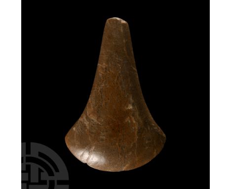 Neolithic Period, circa 6th-4th millennium B.C. With cylindrical body and flat butt, broad curved cutting edge. Cf. similar i