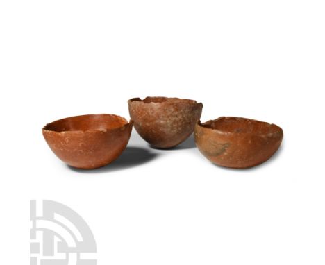Early-Middle Bronze Age, circa 2700-1900 B.C. Group of three hemispherical bowls with burnished surface, one with old collect