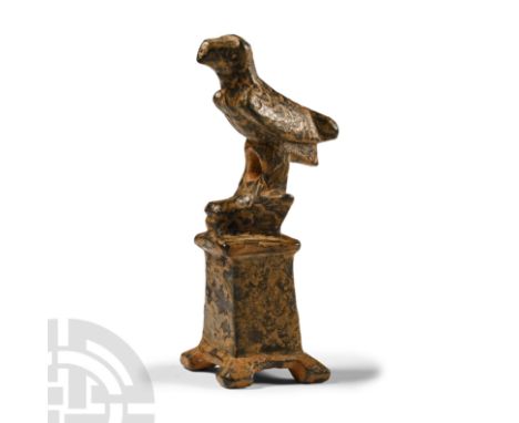 2nd-3rd century A.D.. Comprising an altar with a severed head of a bull on the top and an eagle perching on it; hollow to the