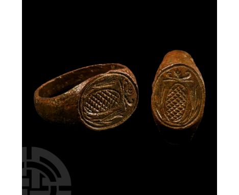 16th-17th century A.D.. With ellipsoid bezel, pseudo-heraldic design of a hatched panel with wreath and scrolled tendrils. Cf