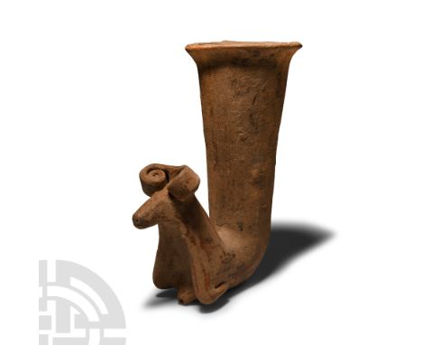 20th century A.D.. With tapering body and everted rim, zoomorphic finial with legs folded beneath the body, coiled horns and 