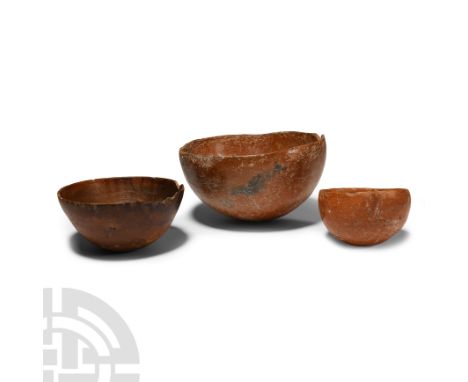 Early-Middle Bronze Age, circa 2700-1900 B.C. Group of three hemispherical bowls with burnished surface, one with old collect