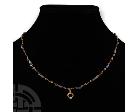 3rd century A.D.. Comprising gold looped links with corner-less oblong and biconvex lapis lazuli beads, hook-and-eye closure,