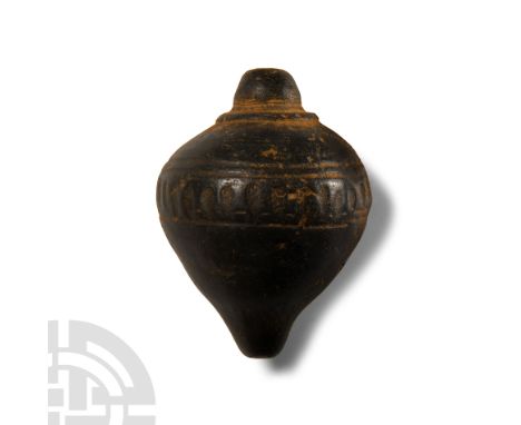 9th-11th century A.D.. Piriform body with domed filler-hole, shoulders decorated with row of geometric patterns, intended to 