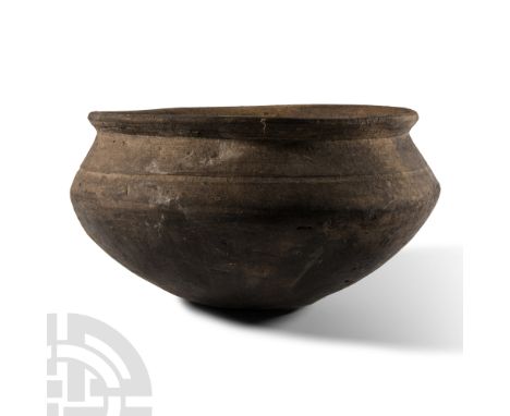 Middle Bronze Age, circa 1000-800 B.C. Squat jar with convex underside, caribated shoulder with incised ring, flared and ever