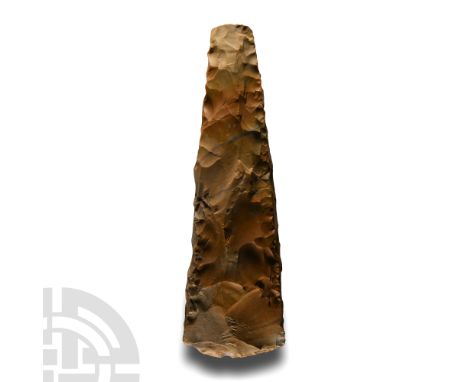 Neolithic Period, 5th-3rd millennium B.C. Square-butted elongated trapezoid, unpolished mottled brown flint, square in sectio