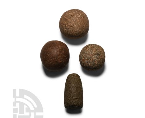 Neolithic Period, circa 6th-4th millennium B.C. Comprising: three irregular spherical hammer-stones; cylindrical hammer with 